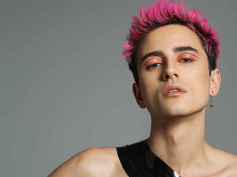 Model with pink hair and pink eyeliner for Haus Labs
